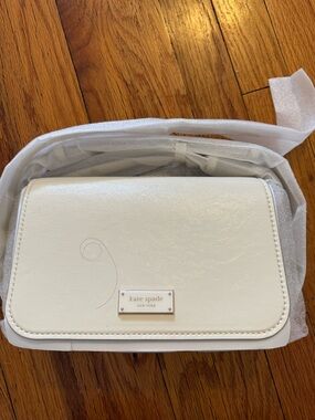 kate spade white leather crossbody with logo plaque